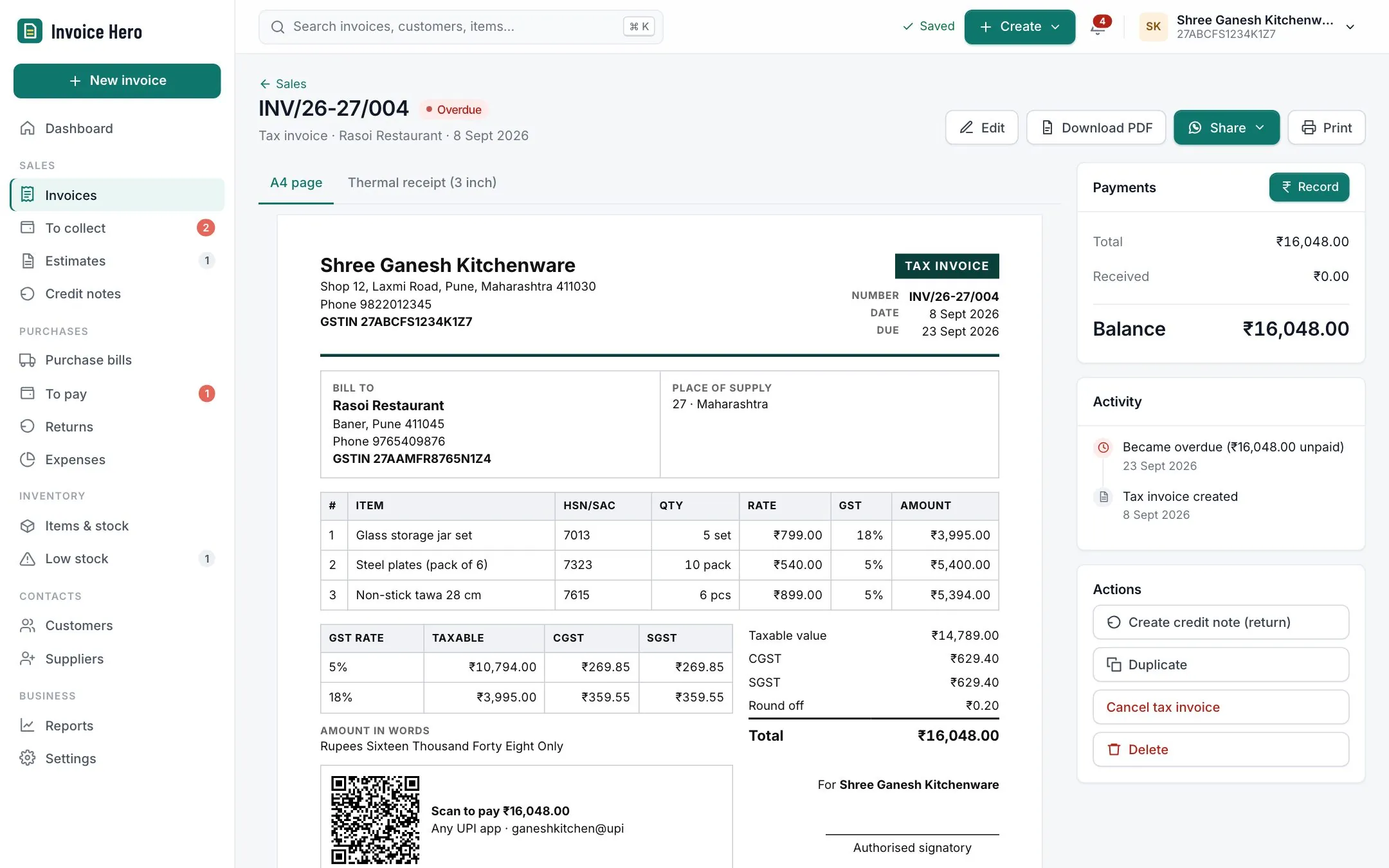 A GST tax invoice with UPI QR code